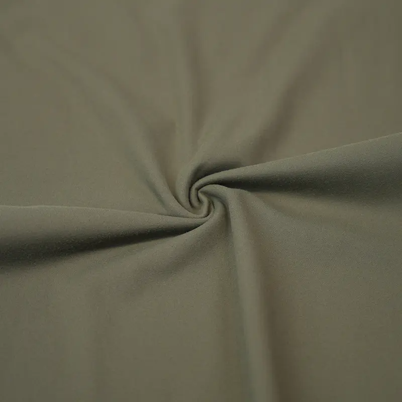 Che cos'è il tessuto di interblocco spandex in nylon e in che modo è diverso dagli altri tipi di tessuti a maglia?